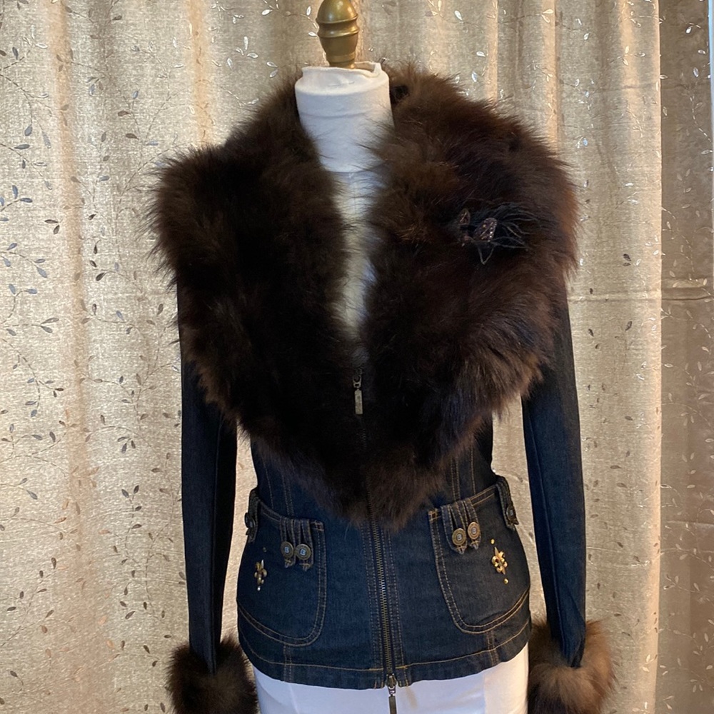 This is a Bisou Bisou denim zip fitted jacket
